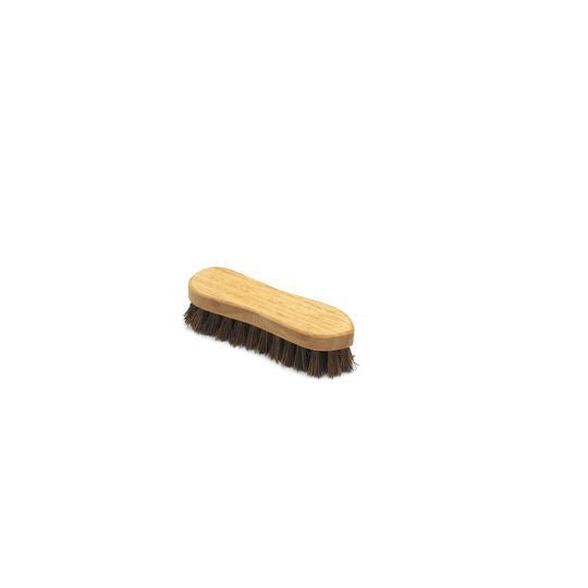 A wooden scrubbing brush with dark bristles and a beige handle on a white background.