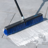 Large broom head scrubbing a patio floor