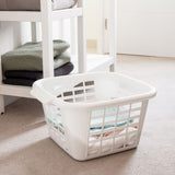 White square laundry basket filled with clothes on a carpeted floor.