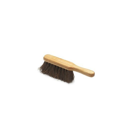 A hand brush with varnished wooden handle and dark bristles