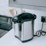 Stainless steel 3.2l thermo pot on a kitchen counter.