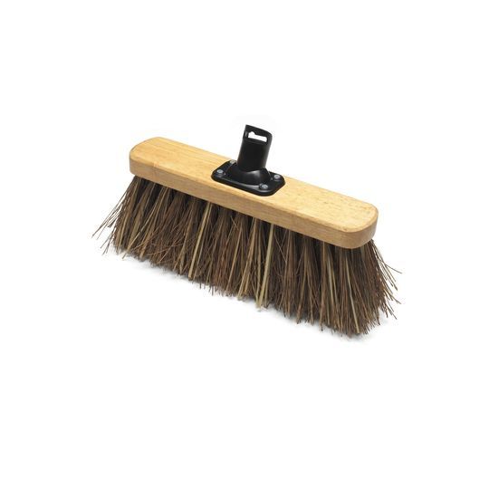 A stiff broom head with brown bristles and a wooden body.