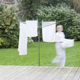Person hanging white laundry onto the 35m rotary airer