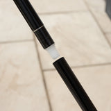 Close-up of a broom pole's screw-in mechanism