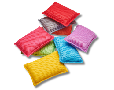 Colorful mesh sponges on a white background